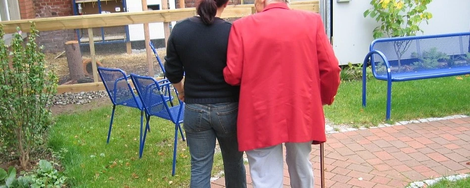 dependent-old-man-walking-with-girl