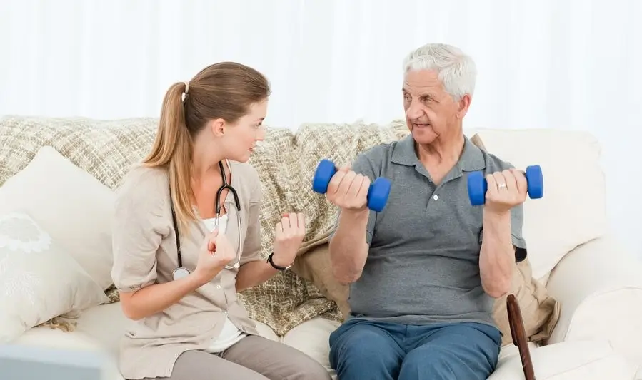 old man taking physiotherapy at home